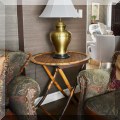 F16. Folding rattan round table. 28&rdquo;h x 37&rdquo;w 